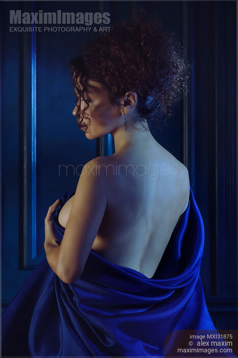 Woman holding bed sheets wrapped around her nude body revealing her naked back Sensual portrait Stock photo of Woman holding bed sheets wrapped around her nude body revealing her naked back Sensual portrait Buy commercial use license at MaximImages