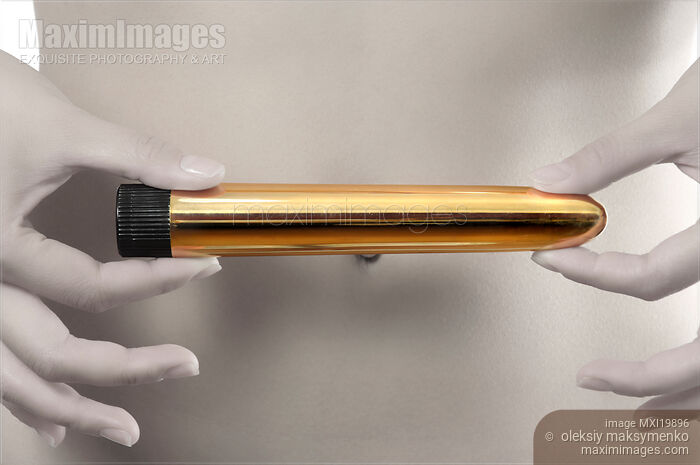 Stock photo of Woman Holding Dildo Vibrator Buy commercial use license at MaximImages