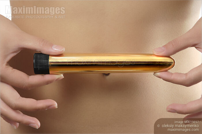 Stock photo of Woman Holding Vibrator Buy commercial use license at MaximImages