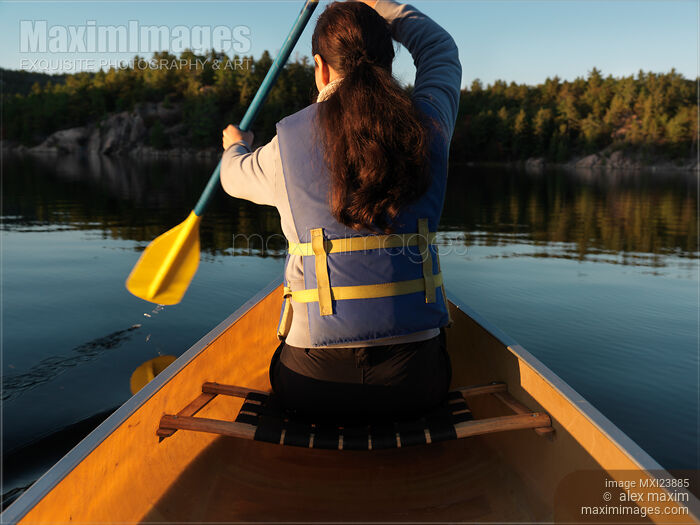 Woman in a Canoe Stock photo of Woman in a Canoe Buy commercial use license at MaximImages
