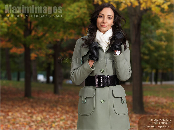 Woman in a City Park Wearing a Green Coat Stock photo of Woman in a City Park Wearing a Green Coat Buy commercial use license at MaximImages