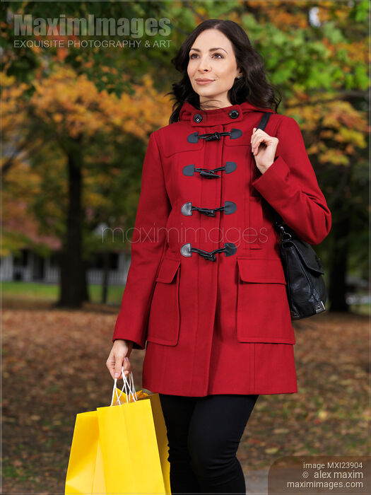 Woman in Fall with Shopping Bags Stock photo of Woman in Fall with Shopping Bags Buy commercial use license at MaximImages