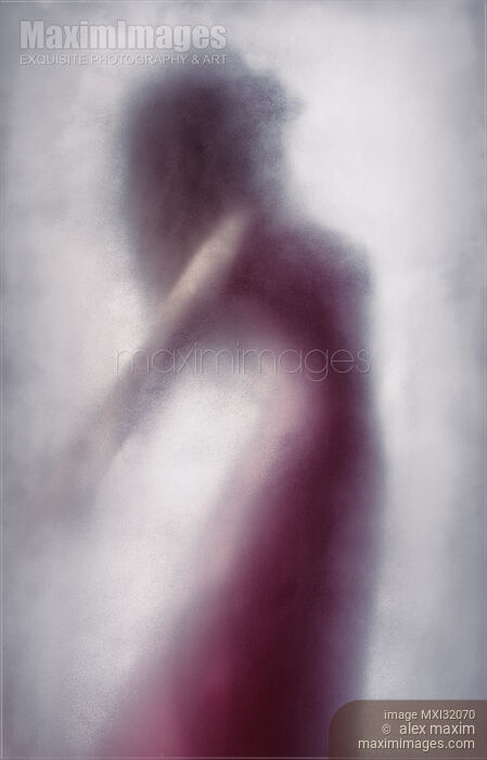Woman in red dress graceful silhouette suspended in leaping motion behind a veil of bright white foggy haze Stock photo of Woman in red dress graceful silhouette suspended in leaping motion behind a veil of bright white foggy haze Buy commercial use license at MaximImages