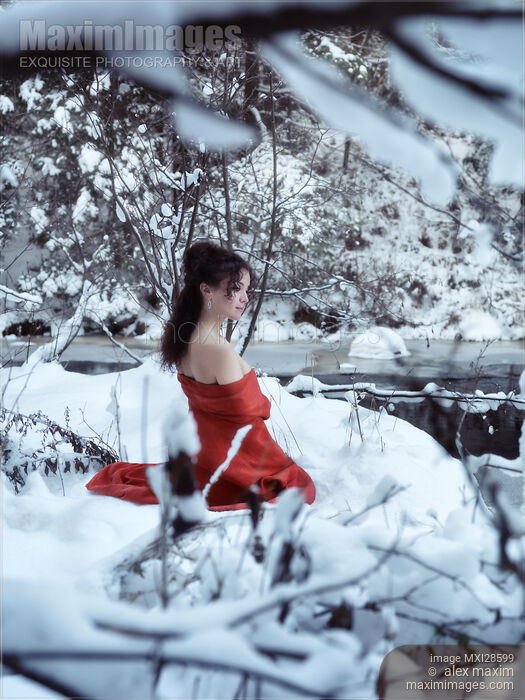 Stock photo of Woman in red kimono with bare shoulders in winter scenery Buy commercial use license at MaximImages
