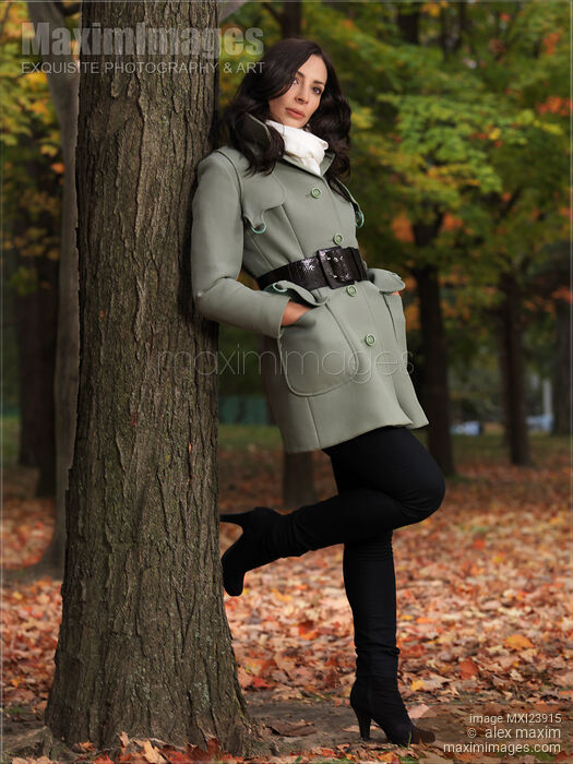 Woman Leaning Against a Tree in Autumn Park Stock photo of Woman Leaning Against a Tree in Autumn Park Buy commercial use license at MaximImages