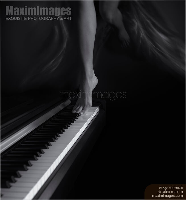 Stock photo of Woman legs dancing on piano Black and white Buy commercial use license at MaximImages