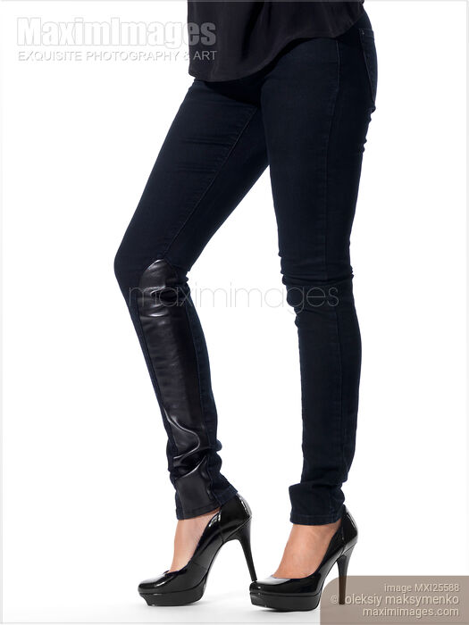 Woman legs in black jeans and high heel shoes Stock photo of Woman legs in black jeans and high heel shoes Buy commercial use license at MaximImages