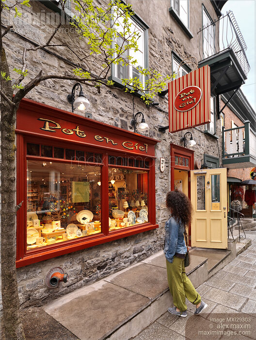 Woman looking at Pot en Ciel shop display on Rue du Petit Champlain historic street in Old Quebec City Stock photo of Woman looking at Pot en Ciel shop display on Rue du Petit Champlain historic street in Old Quebec City Buy commercial use license at MaximImages