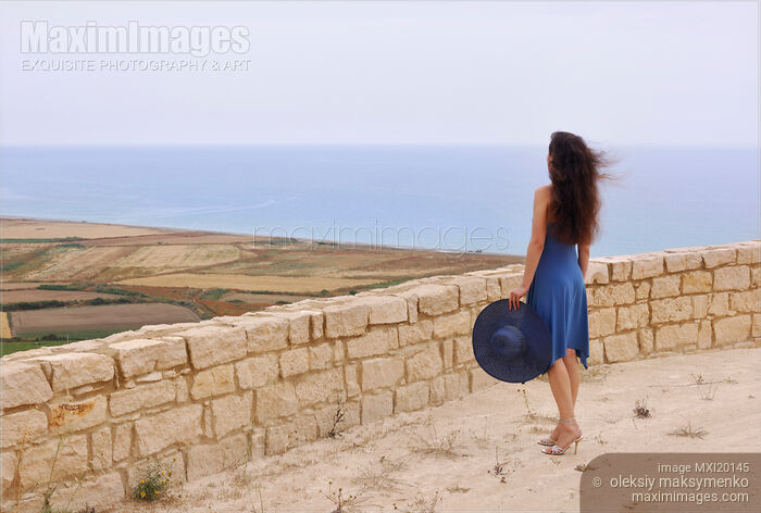 Woman Looking at the Sea Stock photo of Woman Looking at the Sea Buy commercial use license at MaximImages
