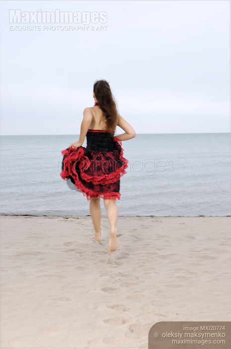 Stock photo of Woman on a Shore Buy commercial use license at MaximImages