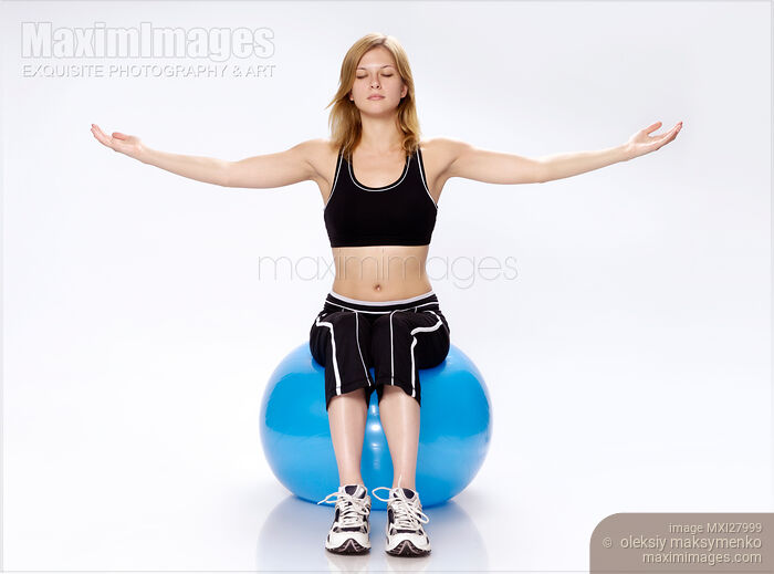 Woman on Exercising Ball Stock photo of Woman on Exercising Ball Buy commercial use license at MaximImages