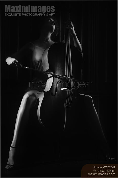 Woman passionately playing cello Dramatic dark contrast black and white portrait Stock photo of Woman passionately playing cello Dramatic dark contrast black and white portrait Buy commercial use license at MaximImages