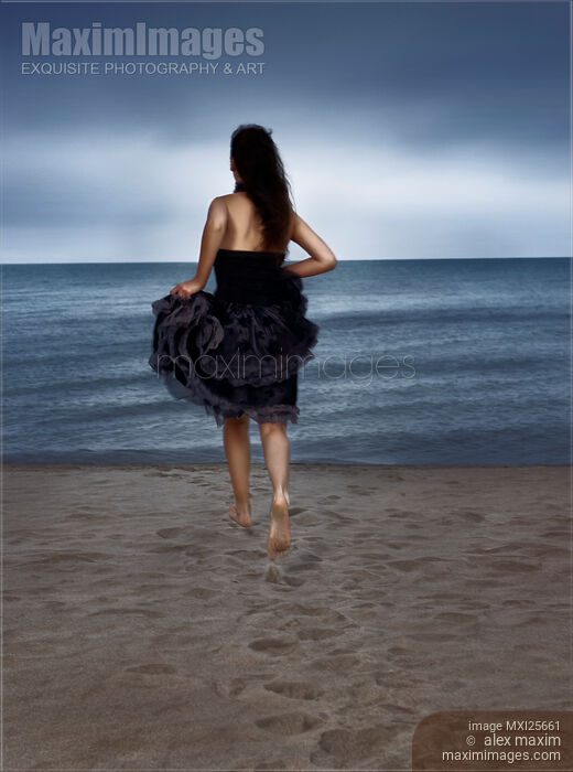 Woman running towards the shore Stock photo of Woman running towards the shore Buy commercial use license at MaximImages