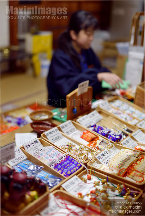 Woman selling fortune and good luck charms at Kiyomizu-dera temple in Japan Stock photo of Woman selling fortune and good luck charms at Kiyomizu-dera temple in Japan Buy commercial use license at MaximImages