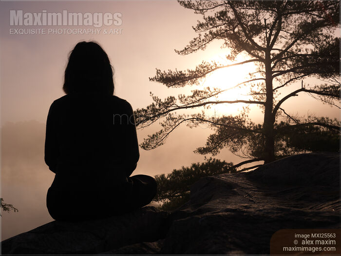Woman silhouette over sunrise sky Stock photo of Woman silhouette over sunrise sky Buy commercial use license at MaximImages