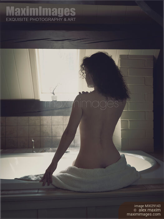 Woman sitting in bathroom undressed back view Stock photo of Woman sitting in bathroom undressed back view Buy commercial use license at MaximImages