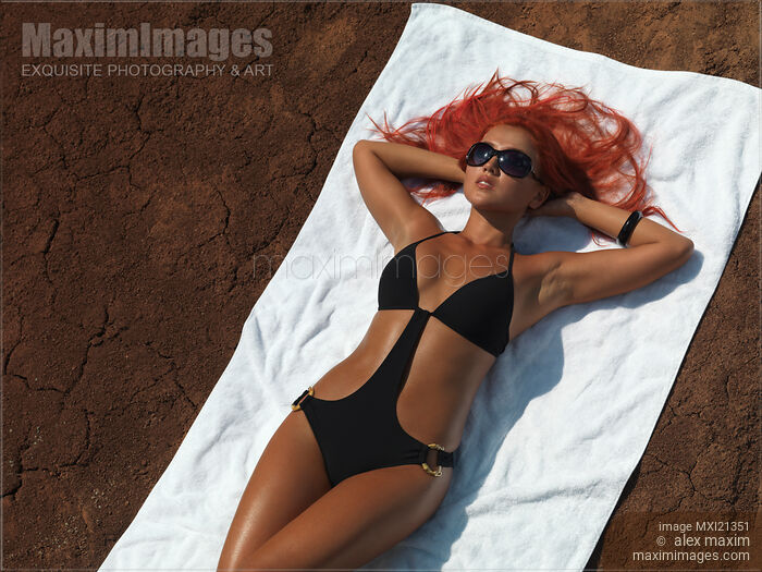 Stock photo of Woman Sunbathing Buy commercial use license at MaximImages