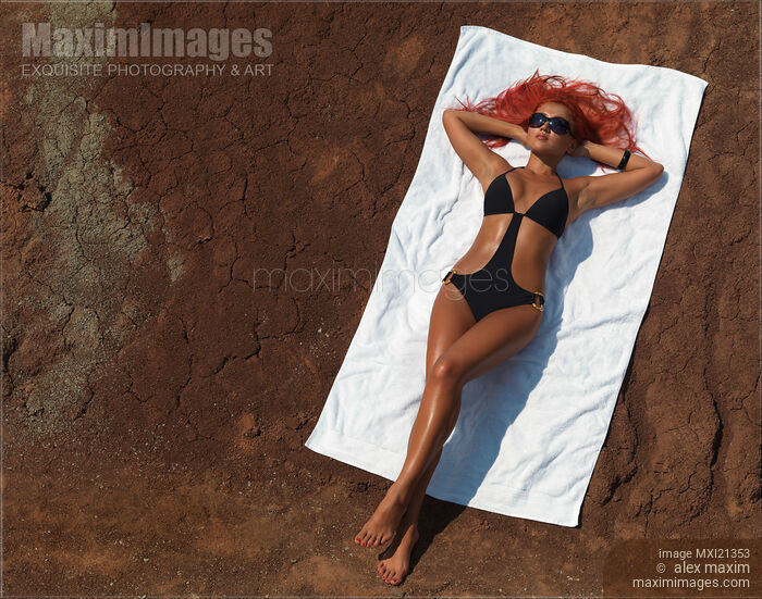 Stock photo of Woman Sunbathing Buy commercial use license at MaximImages