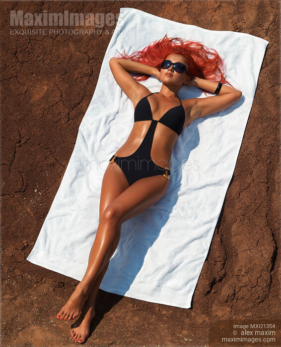 Stock photo of Woman Sunbathing Buy commercial use license at MaximImages