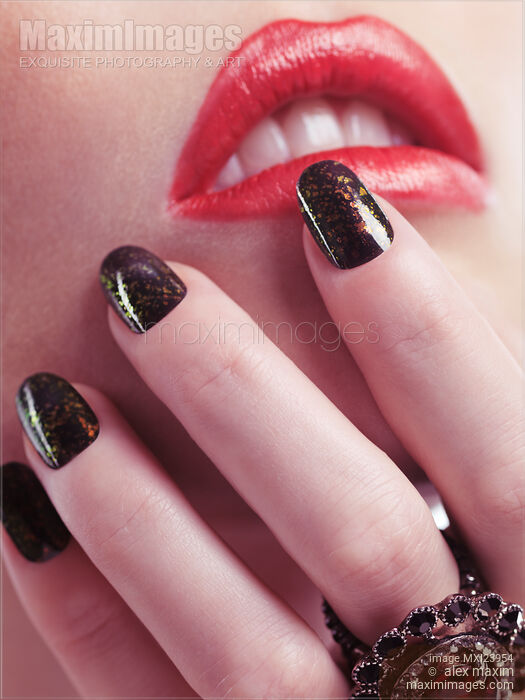 Stock photo of Woman Touching Lips with Her Hand Buy commercial use license at MaximImages