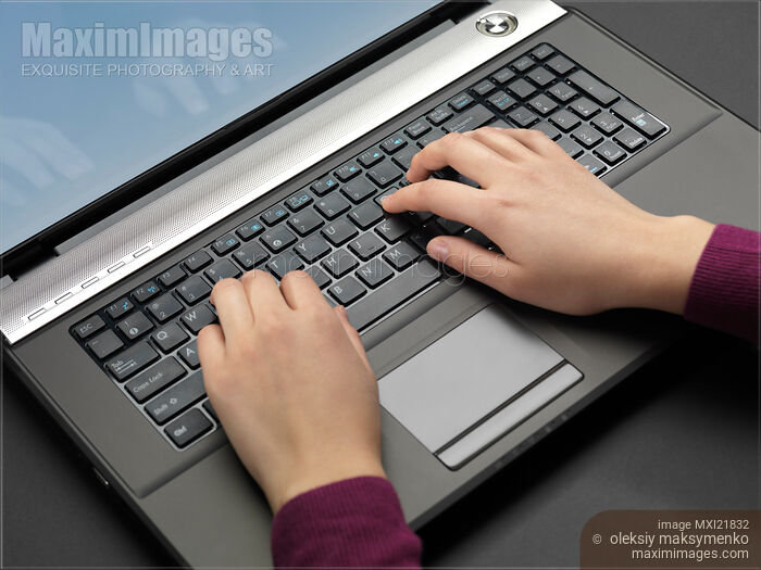 Woman Using a Laptop Computer Stock photo of Woman Using a Laptop Computer Buy commercial use license at MaximImages