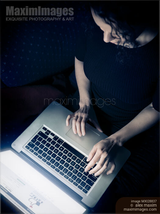 Stock photo of Woman using a laptop view from above Buy commercial use license at MaximImages
