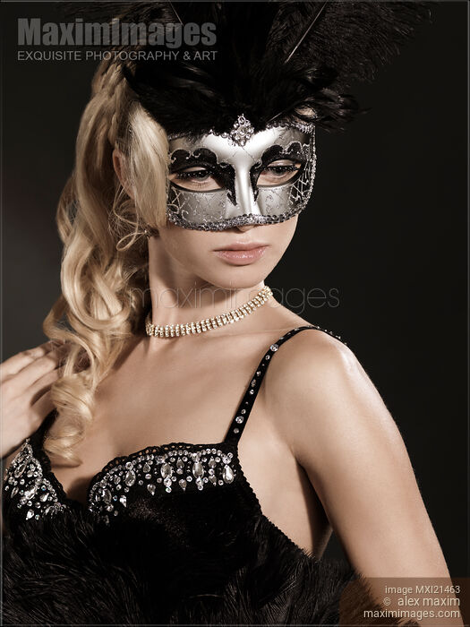 Stock photo of Woman Wearing a Venetian Mask Buy commercial use license at MaximImages