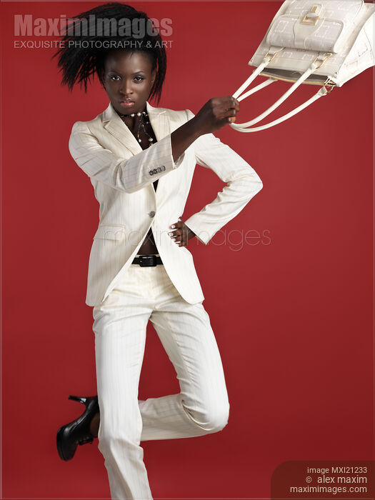 Woman Wearing White Suit Stock photo of Woman Wearing White Suit Buy commercial use license at MaximImages