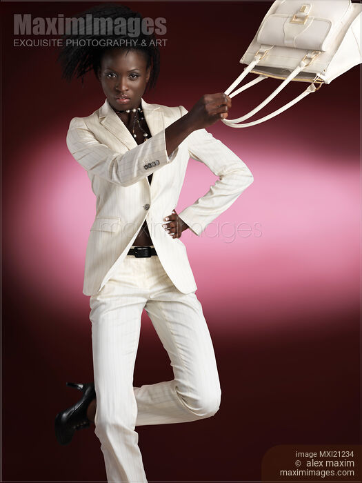Stock photo of Woman Wearing White Suit Buy commercial use license at MaximImages