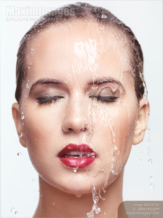 Woman wet face with makeup and lipstick and water running over it Stock photo of Woman wet face with makeup and lipstick and water running over it Buy commercial use license at MaximImages