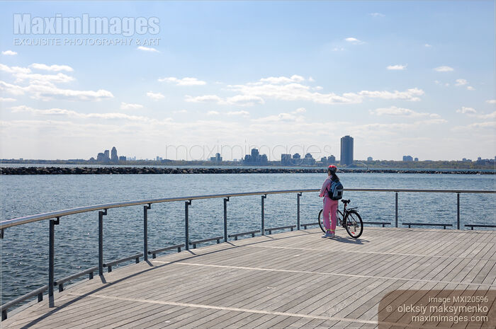 Woman with a Bicycle on a Pier Stock photo of Woman with a Bicycle on a Pier Buy commercial use license at MaximImages