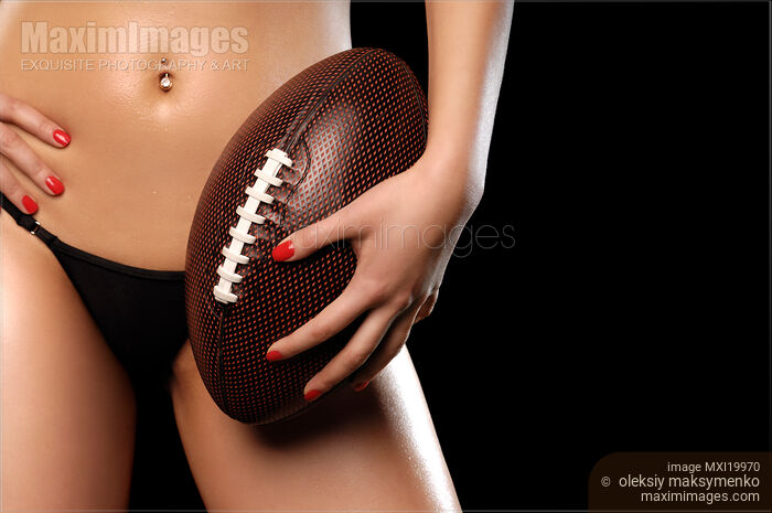 Woman with a Football Stock photo of Woman with a Football Buy commercial use license at MaximImages