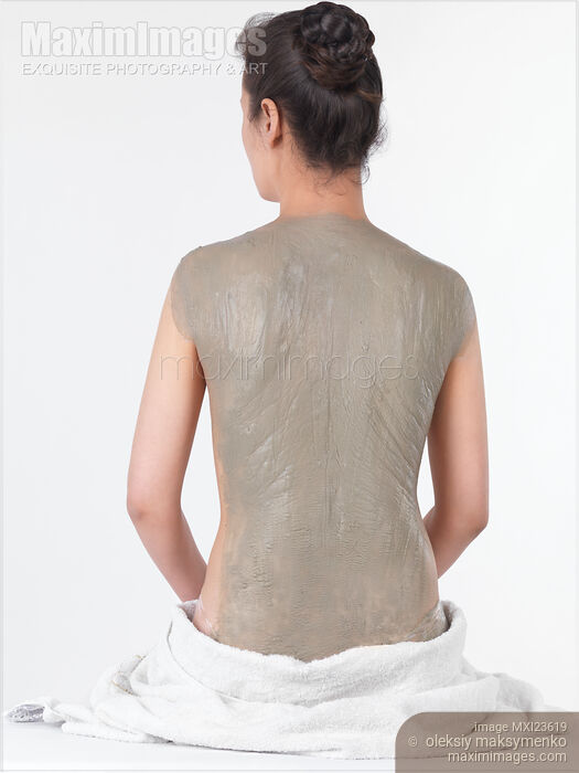 Stock photo of Woman With Bentonite Clay Body Mask Buy commercial use license at MaximImages