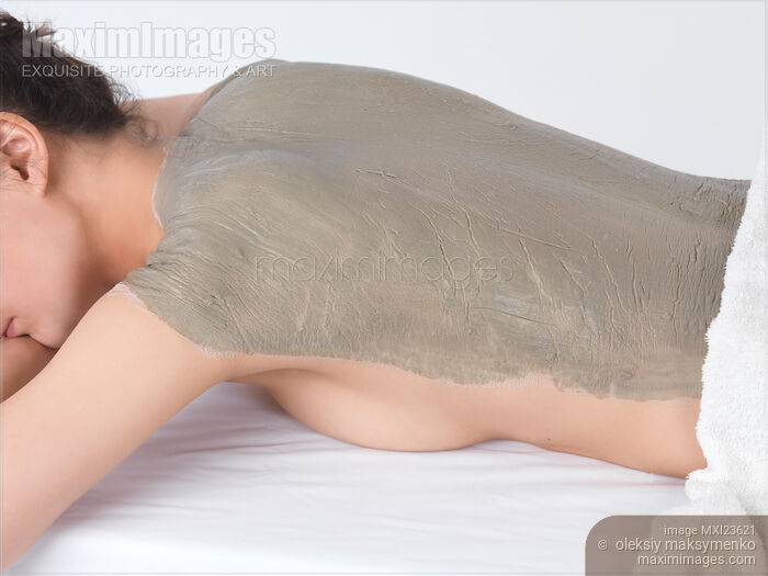 Stock photo of Woman With Bentonite Clay Body Mask Buy commercial use license at MaximImages