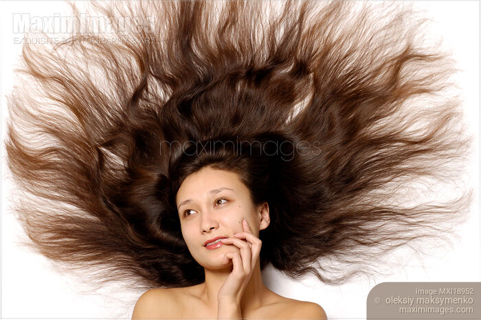 Stock photo of Woman with long beautiful hair Buy commercial use license at MaximImages