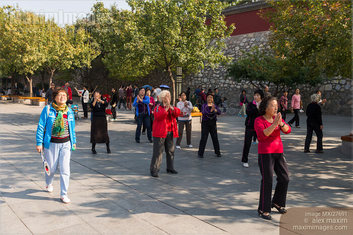 Stock photo of Women dancing at a park in Xi'an China Buy commercial use license at MaximImages