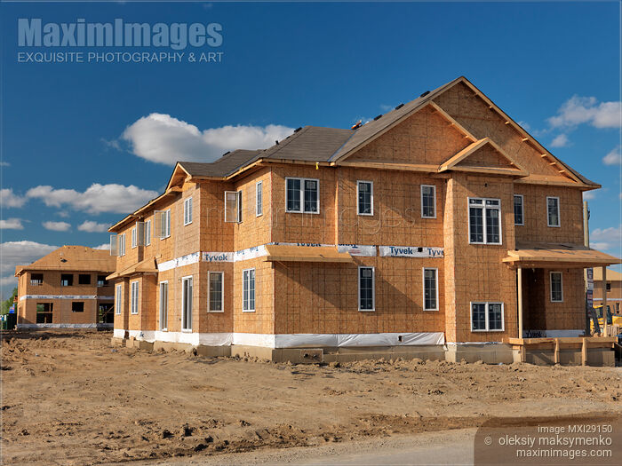 Stock photo of Wooden-Fame House Under Construction Buy commercial use license at MaximImages