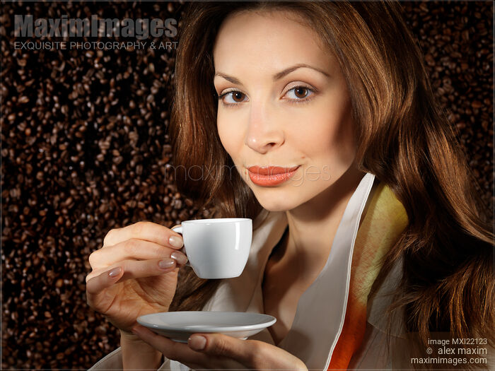 Young Beautiful Woman with a Cup of Coffee Stock photo of Young Beautiful Woman with a Cup of Coffee Buy commercial use license at MaximImages