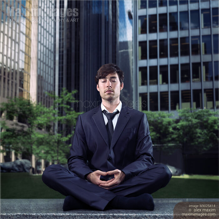 Young businessman meditating in city downtown Stock photo of Young businessman meditating in city downtown Buy commercial use license at MaximImages
