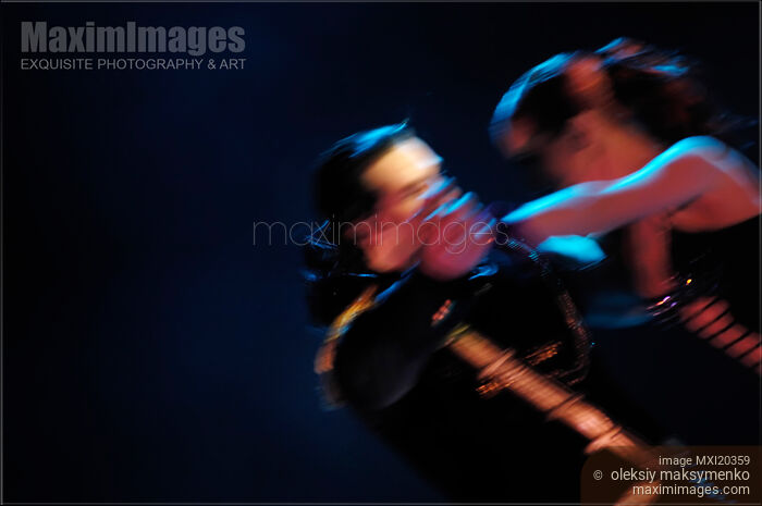 Stock photo of Young Couple Dancing Buy commercial use license at MaximImages