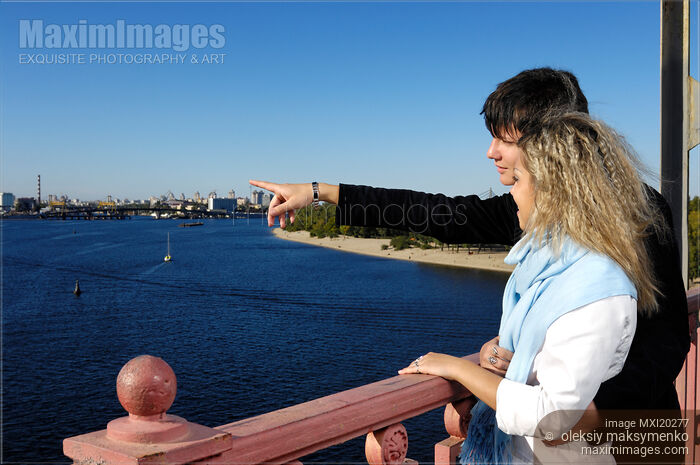 Stock photo of Young Couple on The Bridge Sightseeing Buy commercial use license at MaximImages