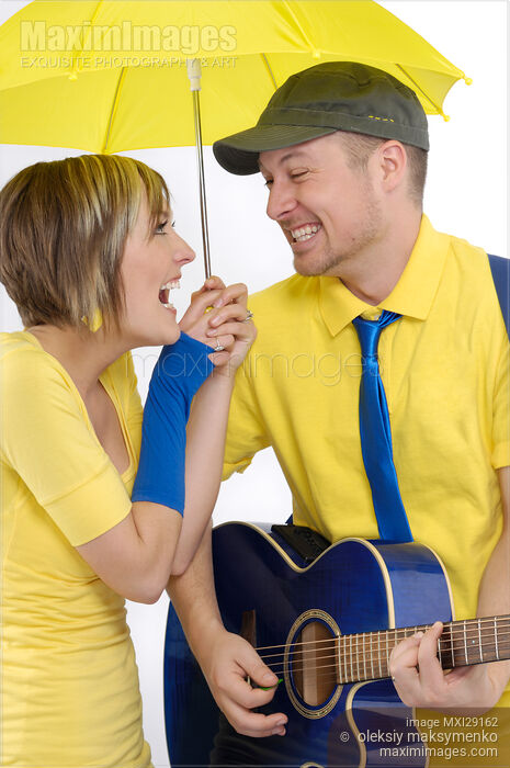 Young Couple Under Umbrella Stock photo of Young Couple Under Umbrella Buy commercial use license at MaximImages