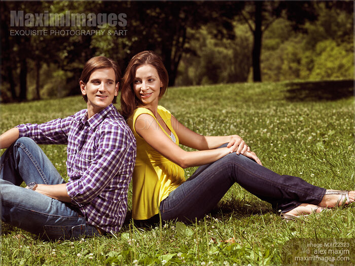 Young Happy Couple in a Park Stock Image MXI22323 © Alex Maxim / MaximImages
