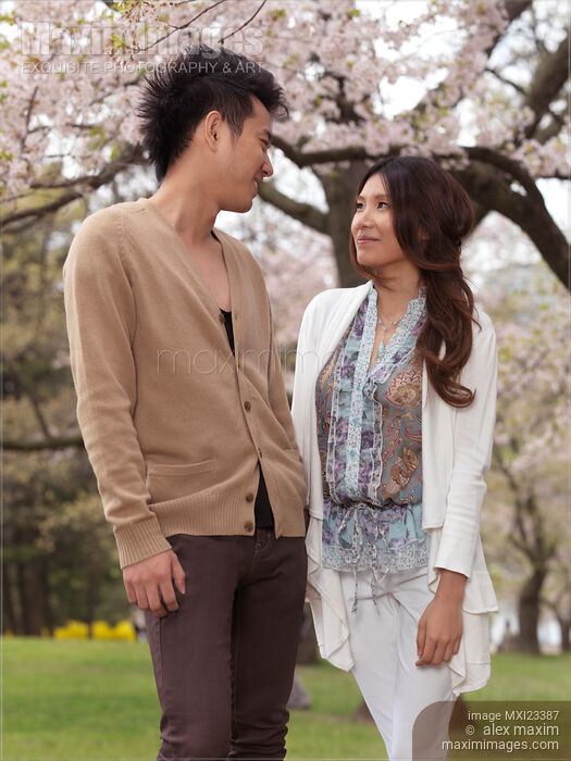 Young Happy Couple in a Park Stock photo of Young Happy Couple in a Park Buy commercial use license at MaximImages