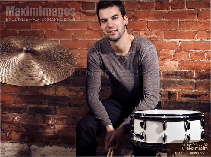 Stock photo of Young man drummer portrait Buy commercial use license at MaximImages