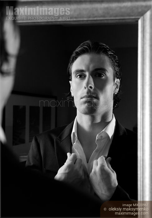 Stock photo of Young Man Looking at a Mirror Buy commercial use license at MaximImages