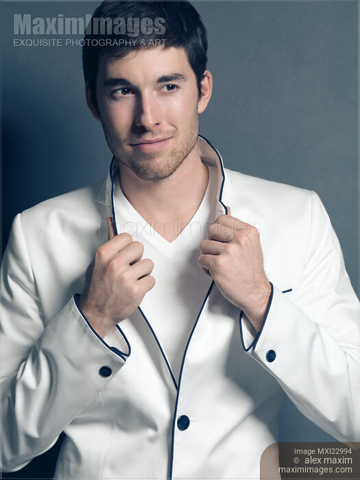 Young Man Wearing White Blazer Stock photo of Young Man Wearing White Blazer Buy commercial use license at MaximImages