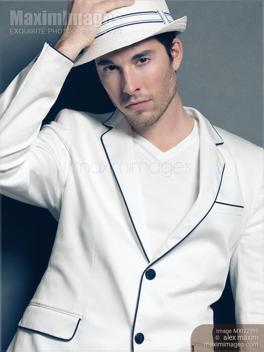 Stock photo of Young Man Wearing White Blazer Buy commercial use license at MaximImages