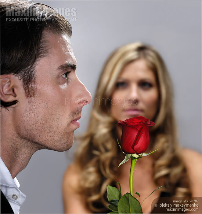 Young Man with a Red Rose Stock photo of Young Man with a Red Rose Buy commercial use license at MaximImages
