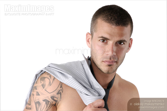 Young Man with a Shirt over His Shoulder Stock photo of Young Man with a Shirt over His Shoulder Buy commercial use license at MaximImages